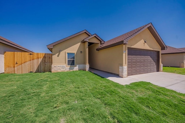 ranch-style house featuring a garage and a front yard