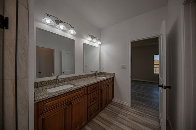 bathroom featuring hardwood / wood-style flooring and vanity