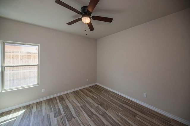 unfurnished room with wood-type flooring and ceiling fan