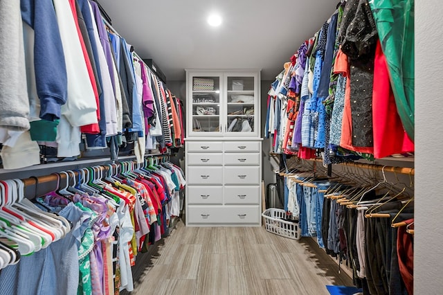 spacious closet featuring wood finished floors