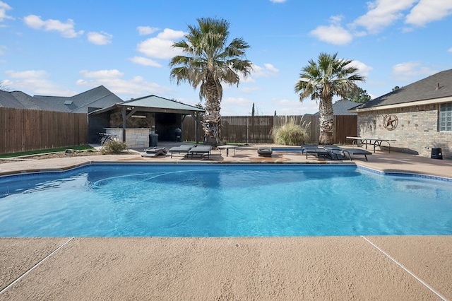 view of swimming pool featuring a gazebo, a patio, and a fenced backyard