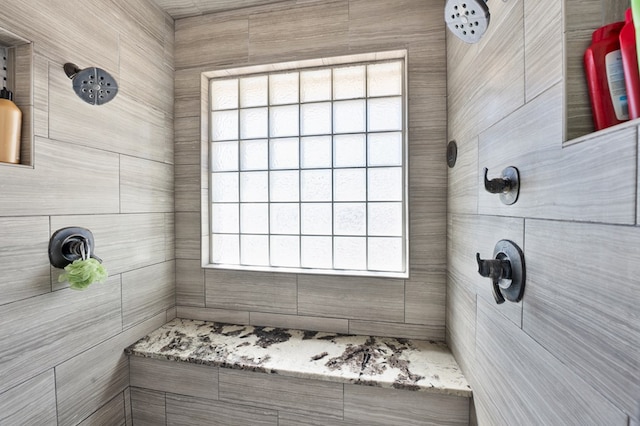 full bathroom featuring tiled shower