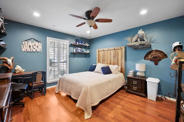 bedroom with ceiling fan, recessed lighting, wood finished floors, and baseboards