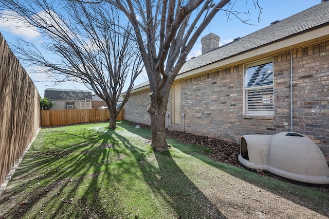 view of yard with a fenced backyard