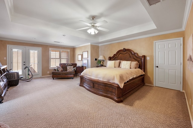 bedroom with french doors, a raised ceiling, light colored carpet, visible vents, and access to outside