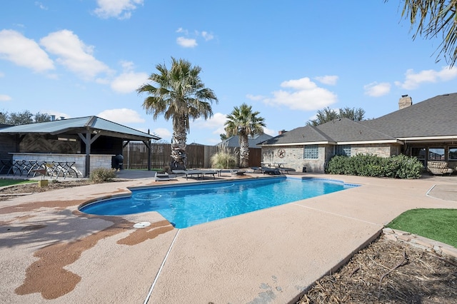 view of pool featuring a patio area, fence, and a fenced in pool