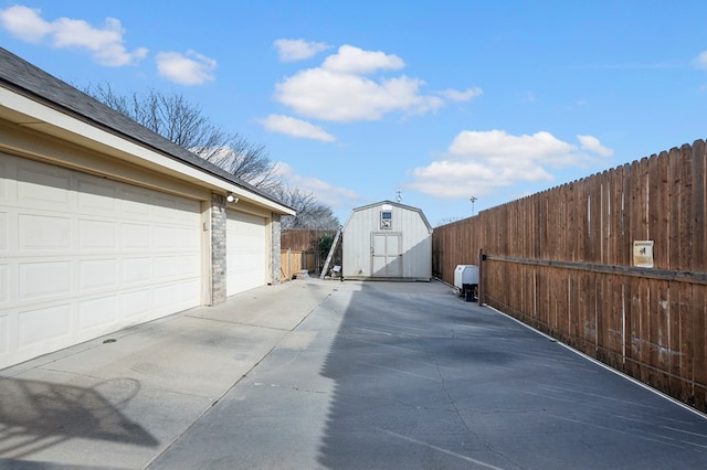 view of road featuring concrete driveway