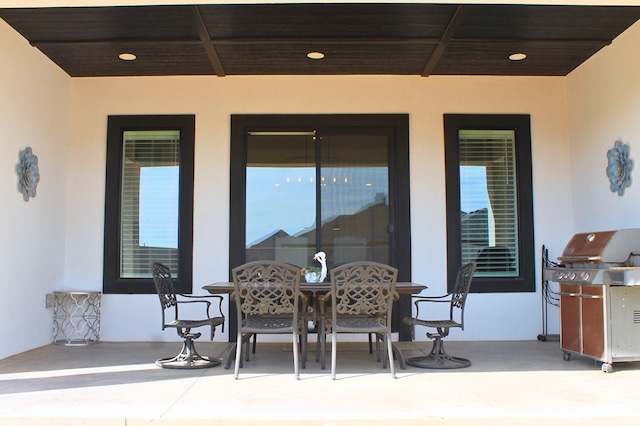 view of patio / terrace with outdoor dining area and a grill