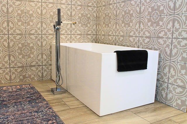 bathroom with wood tiled floor