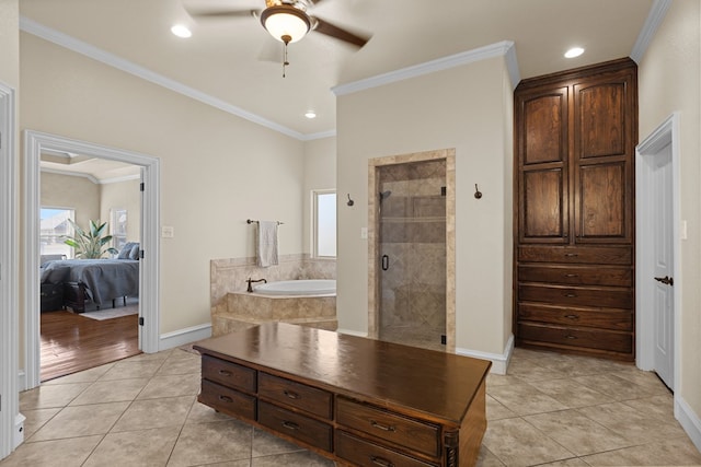 bathroom with tile patterned flooring, ceiling fan, crown molding, and independent shower and bath