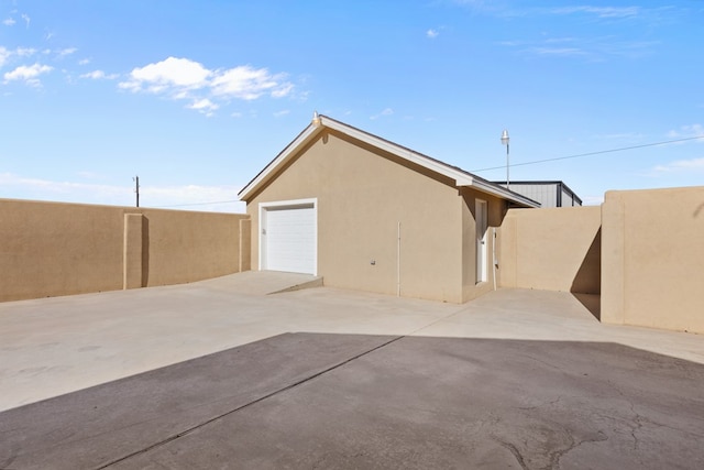 view of side of property with a garage