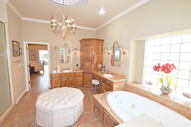 bathroom featuring tile patterned floors, crown molding, vanity, a bathing tub, and a notable chandelier