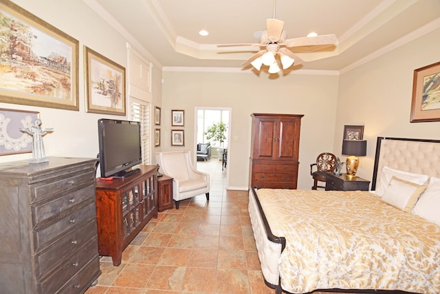 bedroom featuring a tray ceiling and ornamental molding