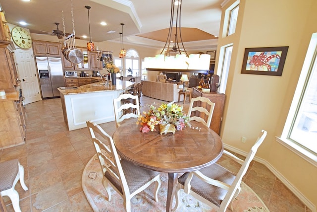 dining room featuring lofted ceiling and sink