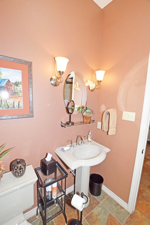 bathroom featuring sink and toilet