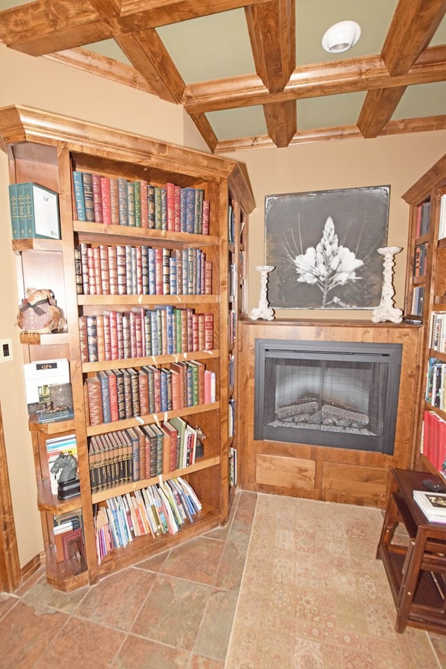 sitting room featuring coffered ceiling and beam ceiling