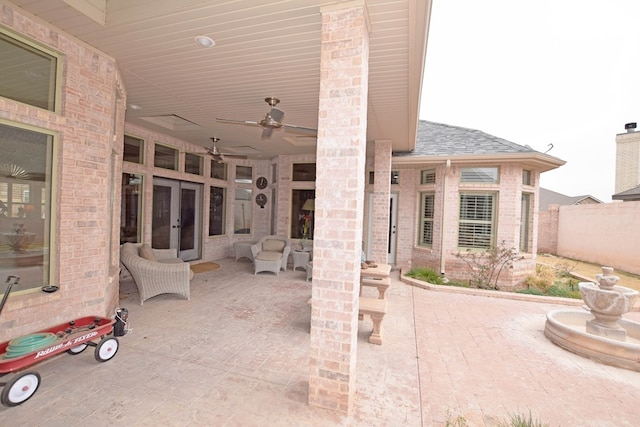 view of patio / terrace featuring ceiling fan and french doors