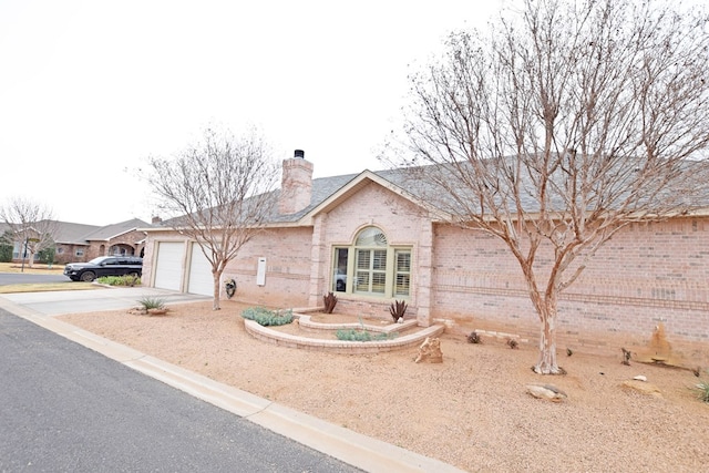 ranch-style house featuring a garage