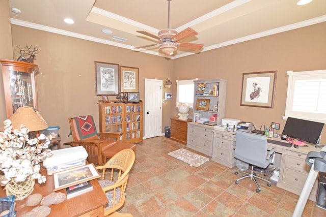 office space with ornamental molding, a raised ceiling, and ceiling fan