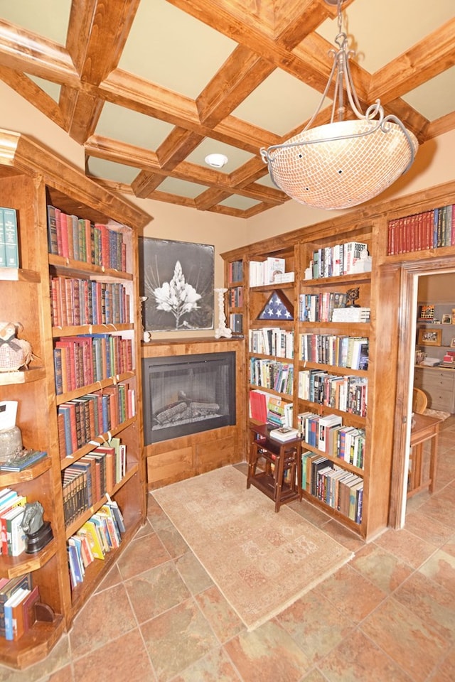 living area with beamed ceiling and coffered ceiling