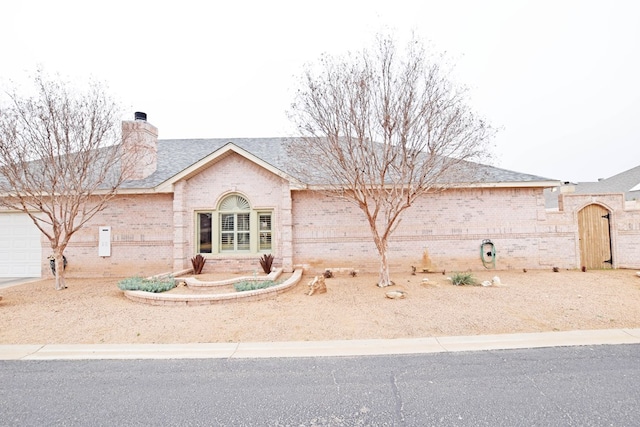 ranch-style home featuring a garage