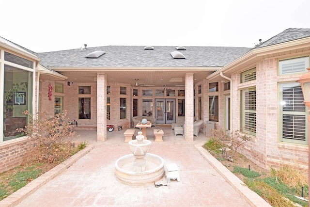 view of patio featuring ceiling fan