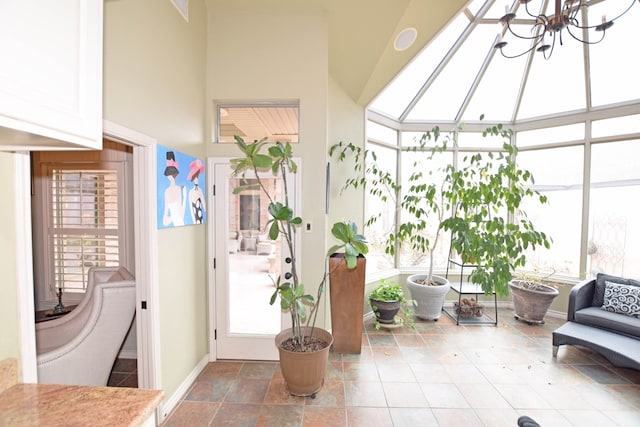 sunroom / solarium with an inviting chandelier