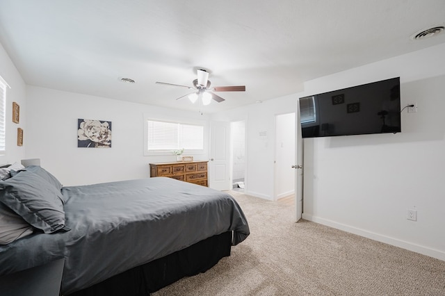 bedroom featuring ceiling fan and light colored carpet