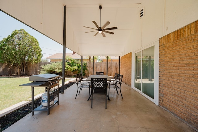 view of patio featuring area for grilling and ceiling fan