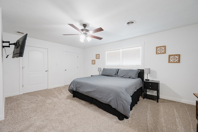 carpeted bedroom with ceiling fan