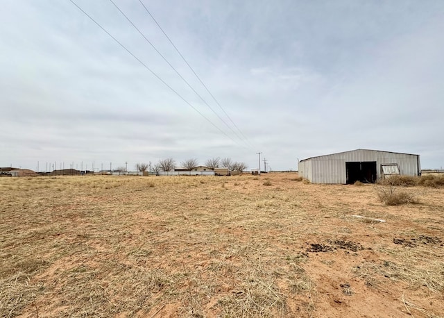 view of yard featuring an outbuilding and an outdoor structure