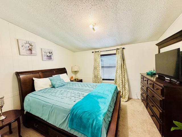 bedroom featuring a textured ceiling, carpet flooring, and vaulted ceiling