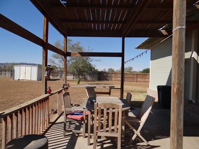 view of patio / terrace featuring a storage unit