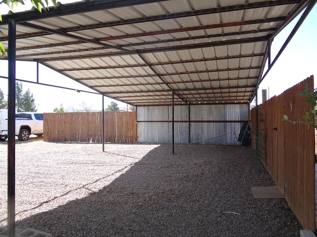 view of parking / parking lot with a carport