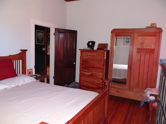 bedroom featuring dark wood-type flooring