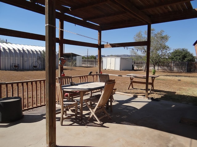 view of patio with a shed