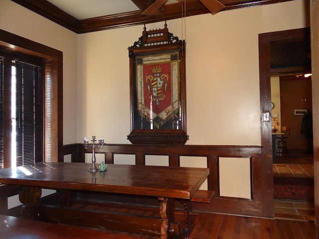 dining room featuring wood-type flooring and ornamental molding