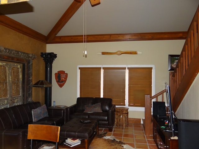 tiled living room with beam ceiling and high vaulted ceiling