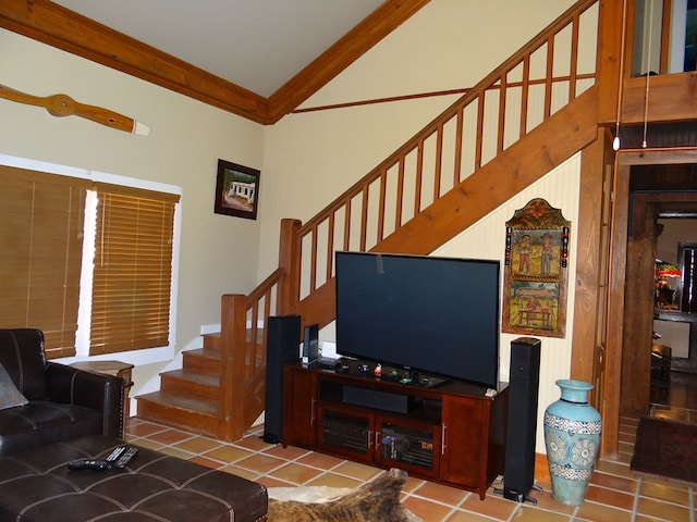 living room with tile patterned flooring, vaulted ceiling, and ornamental molding