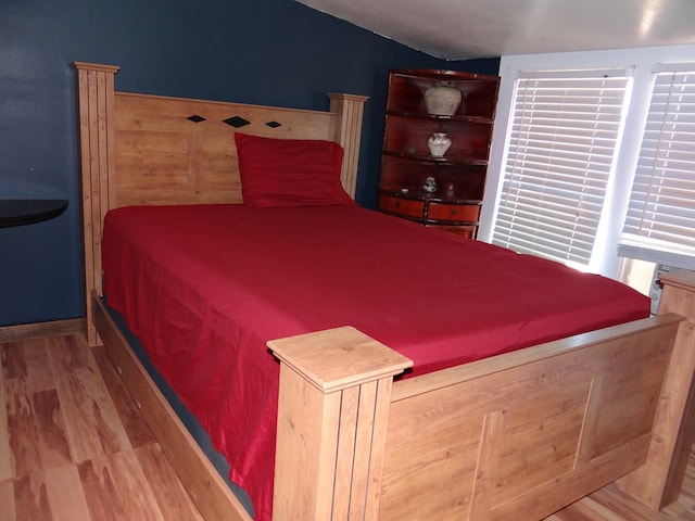 bedroom with light wood-type flooring