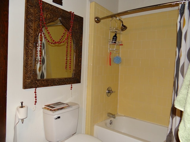 bathroom with shower / bath combination with curtain and toilet