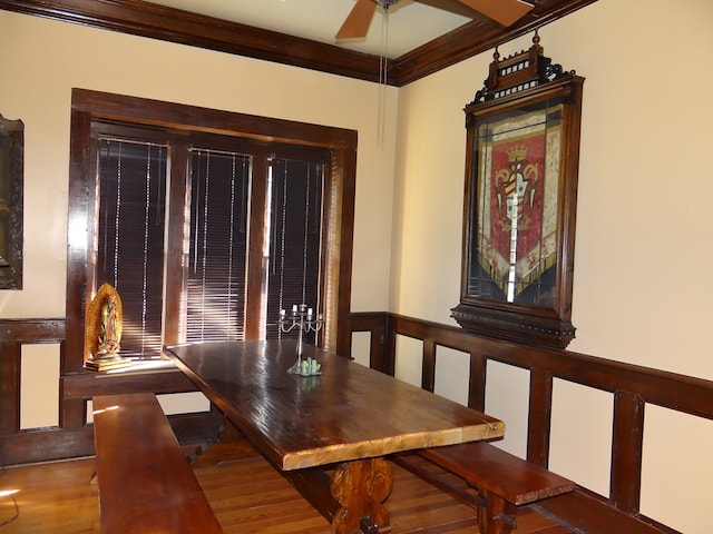 dining room with crown molding, hardwood / wood-style floors, and ceiling fan