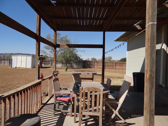 view of patio with a storage shed