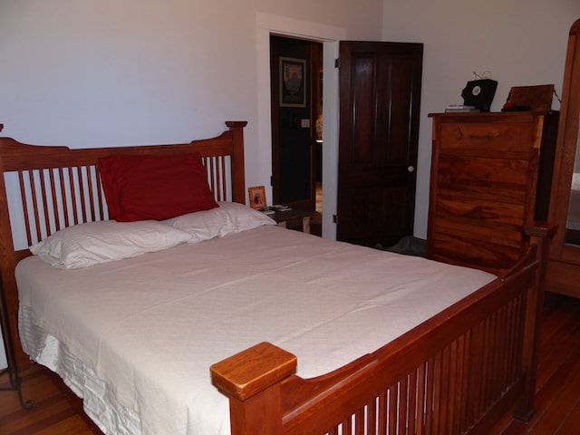 bedroom featuring dark wood-type flooring