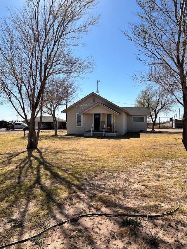 back of property with a yard