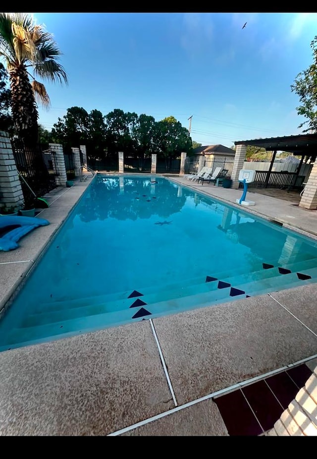 view of swimming pool featuring a patio area