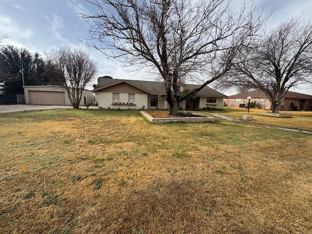 ranch-style house with a garage and a front yard