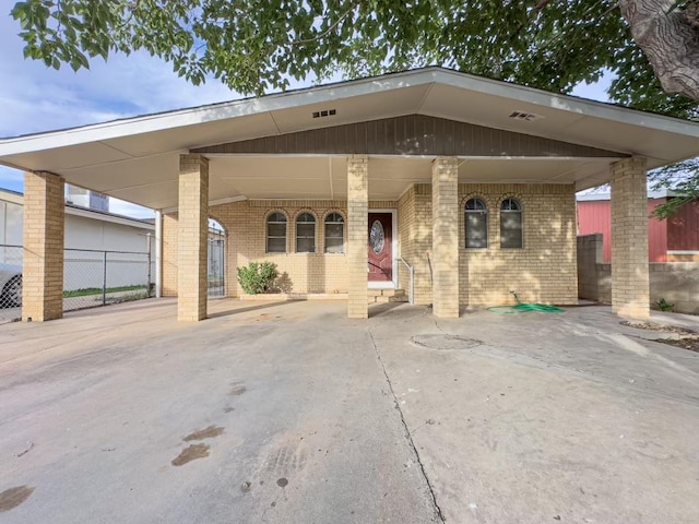 view of front of property with a carport