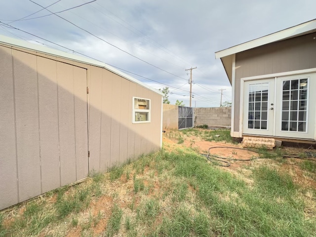 view of yard with french doors