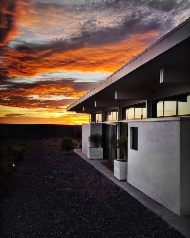 view of property exterior at dusk